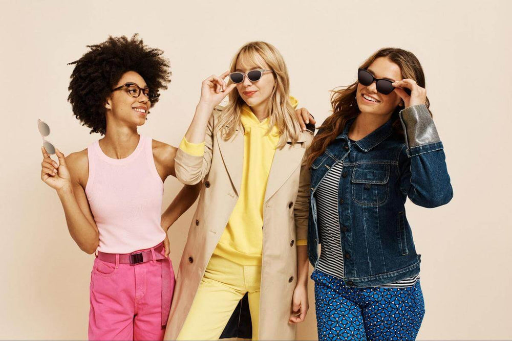 Custom clip on sunglasses: women wearing sunglasses and a pair of eyeglasses